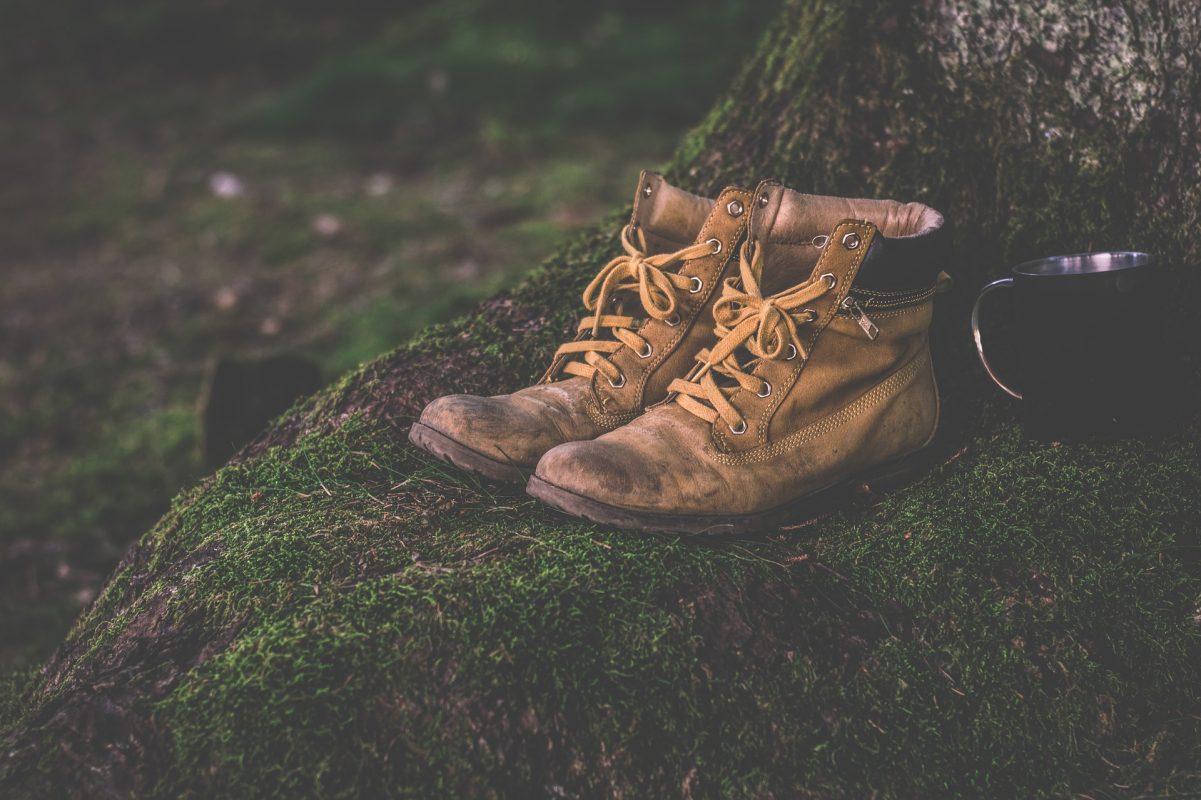 hiking boots on green grassy place