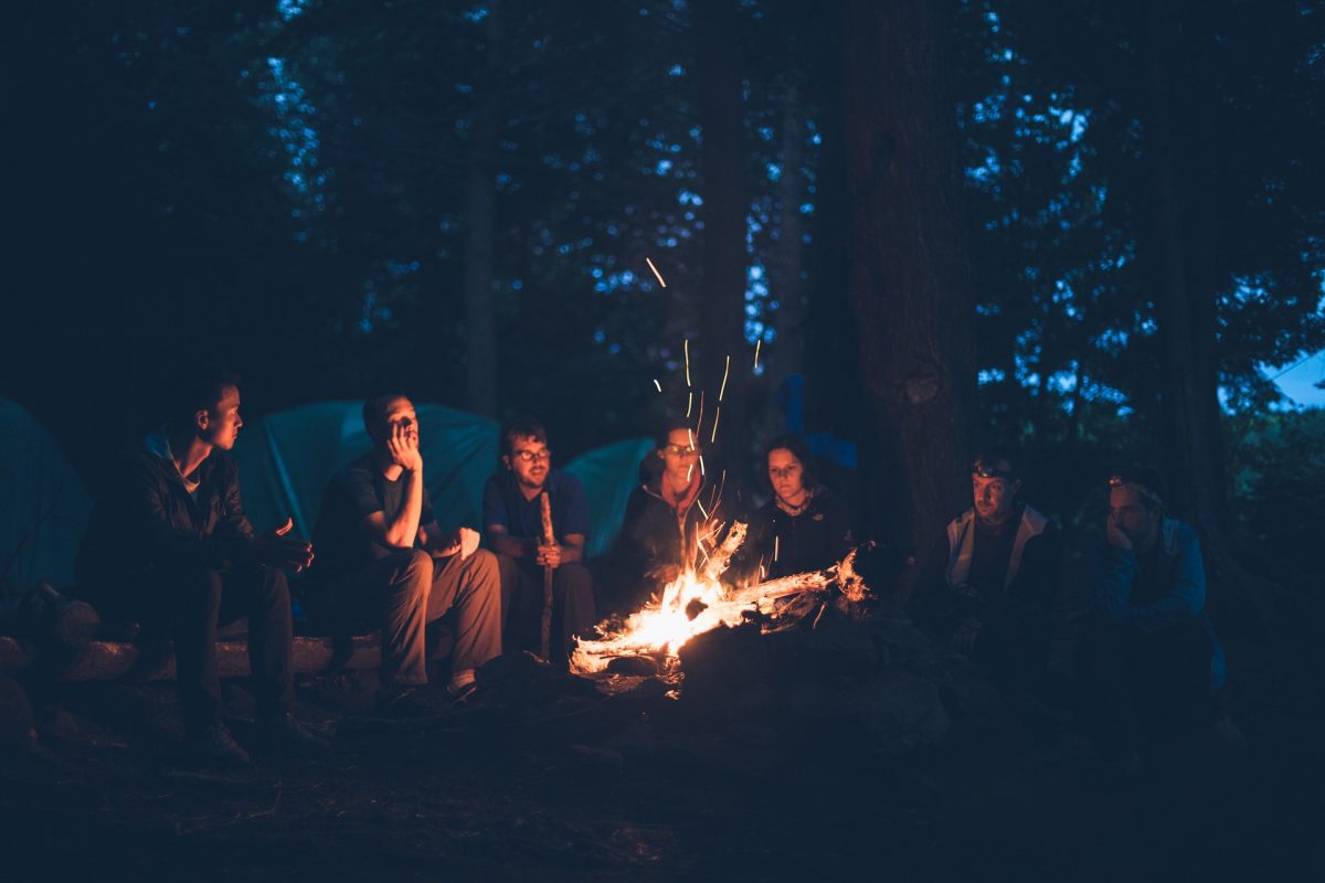 children camping at a bonfire