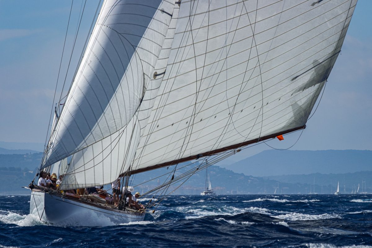 white and brown sailing boat with sails