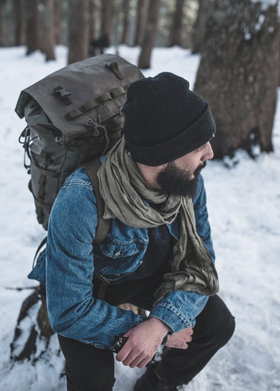 man hiking in winter